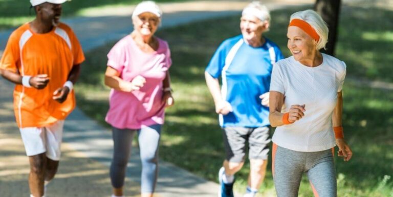 Group of Seniors Jogging to Stay Fit Outside an Assisted Living Facility