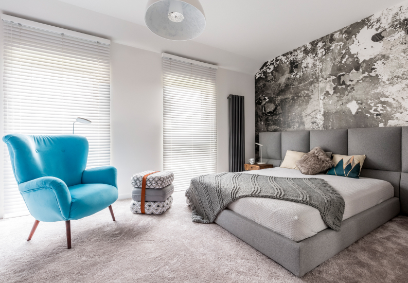 Modern Bedroom With Blue Accent Chair and Wall Art at Assisted Living Facility Modern Bedroom With Blue Accent Chair and Wall Art at Assisted Living Facility